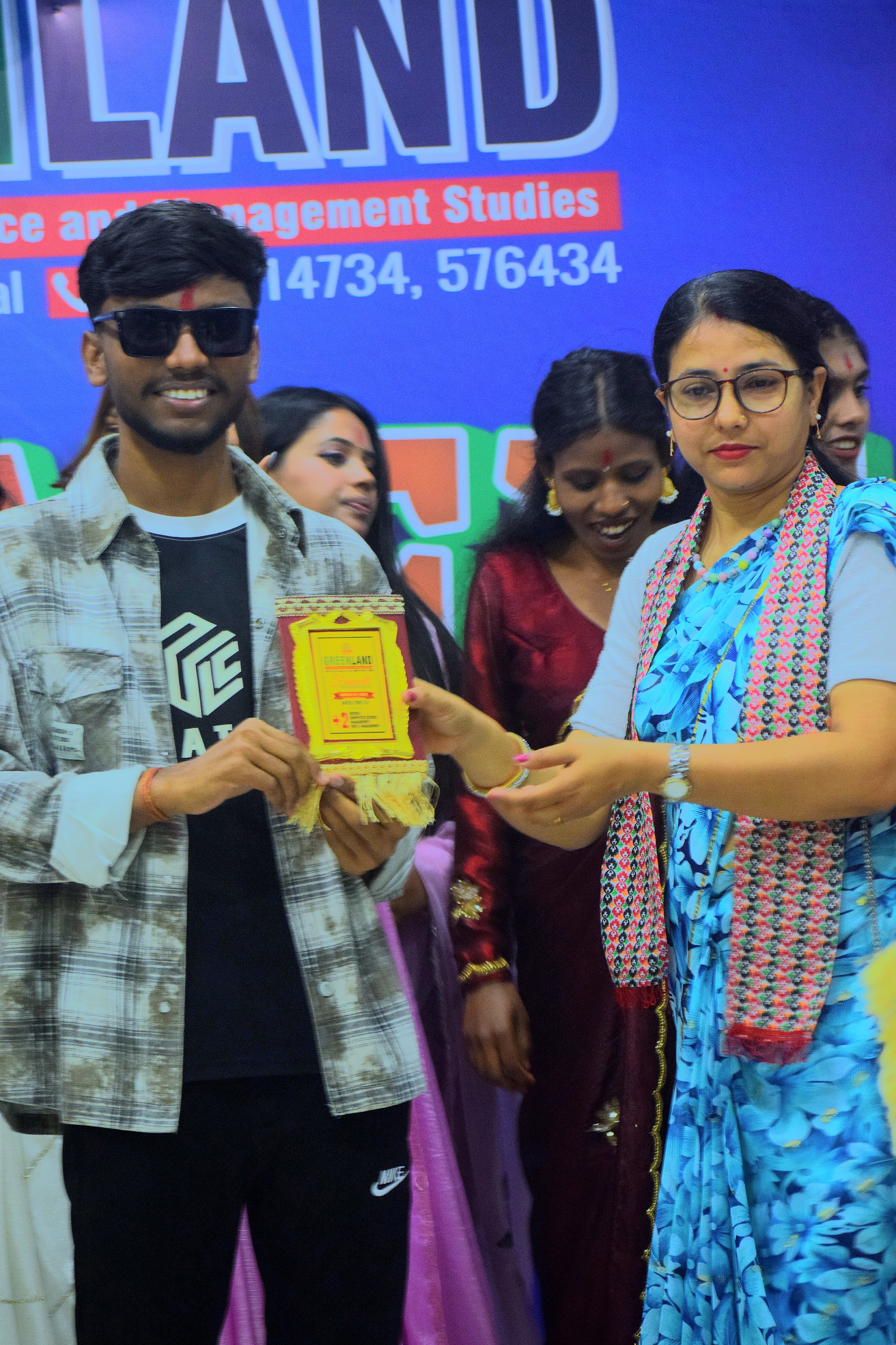 Dhanraj Sah receiving a token of love from Greenland College