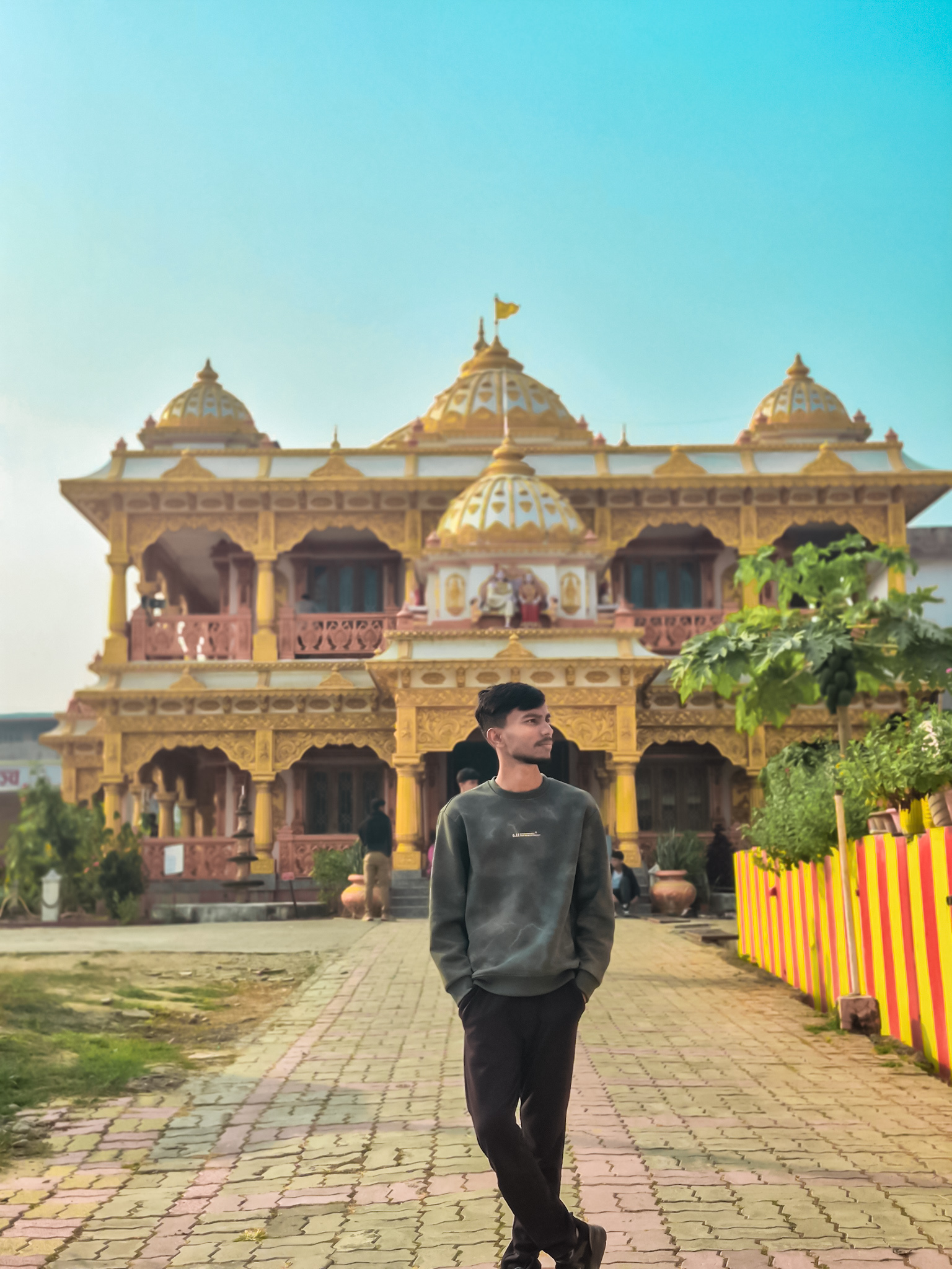 Dhanraj Sah visiting a temple during a tour